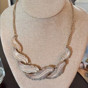 Gold tone Feather Statement Necklace - with rhinestones along the middle of leaf